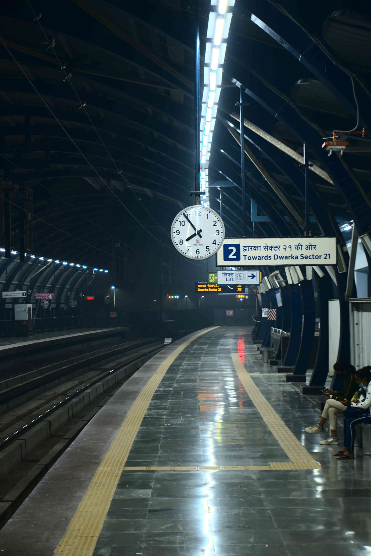 A nearly empty Delhi Metro platform late at night
